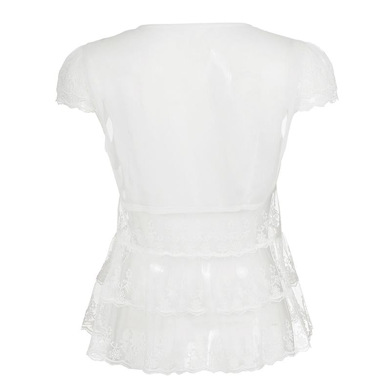 Amélie · Top peplum de encaje translúcido con escote pronunciado