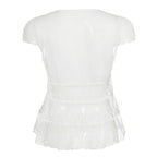 Amélie · Top peplum de encaje translúcido con escote pronunciado