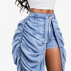 Amélie · Pantalón corto vaquero con capa drapeada