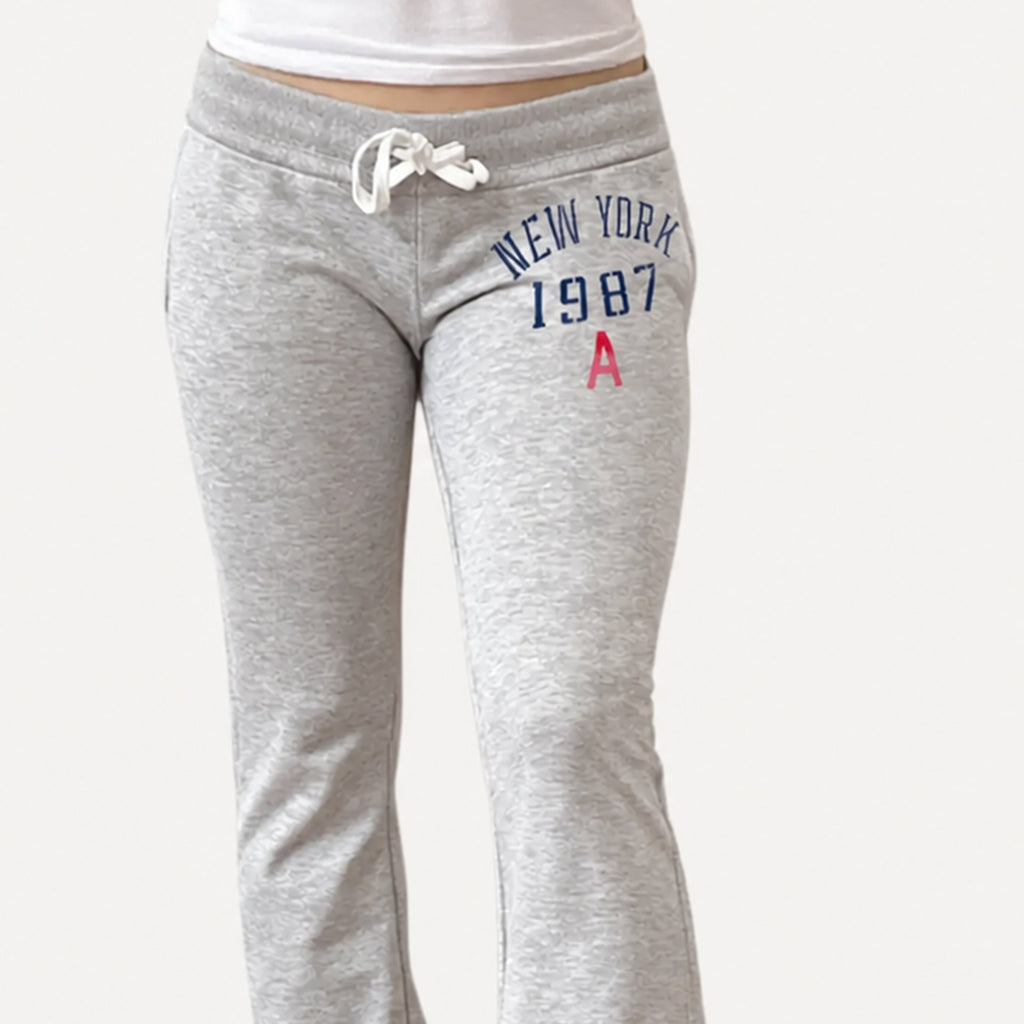 Amélie · Pantalón de campana de tiro bajo con cordón y estampado