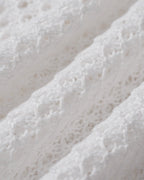 Pareo de punto blanco con aberturas