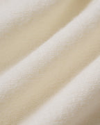 Chaqueta de punto blanco roto con cuello redondo y botones