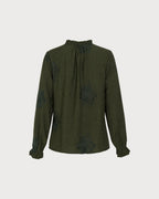 Camisa verde bordada con volantes y botones