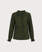 Camisa verde bordada con volantes y botones