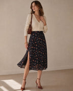 Falda midi negra de gasa con flores y abertura