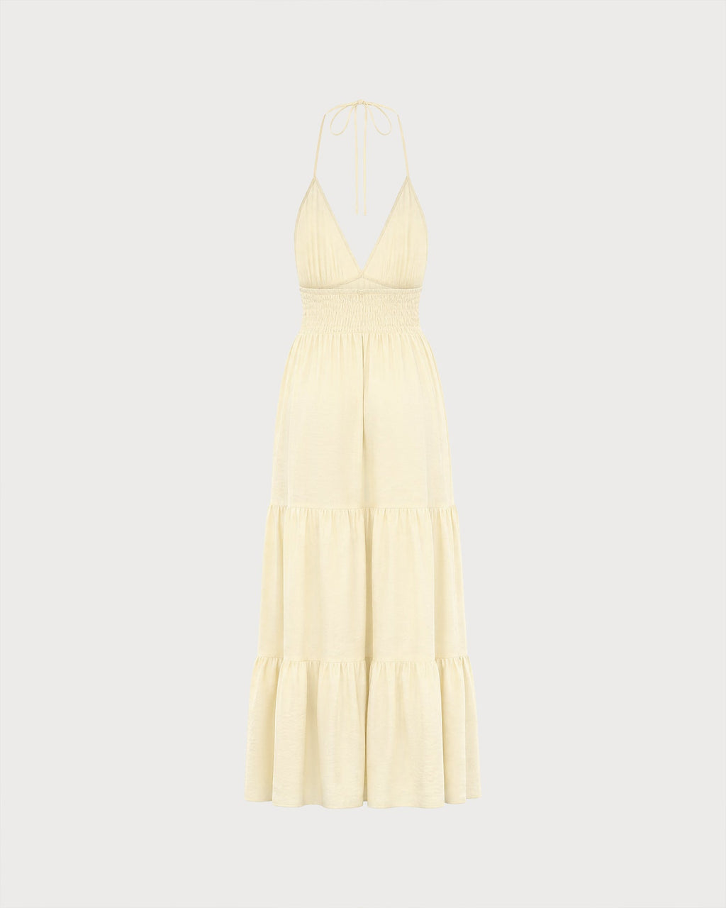 Vestido de playa amarillo fruncido con espalda descubierta