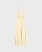 Vestido de playa amarillo fruncido con espalda descubierta